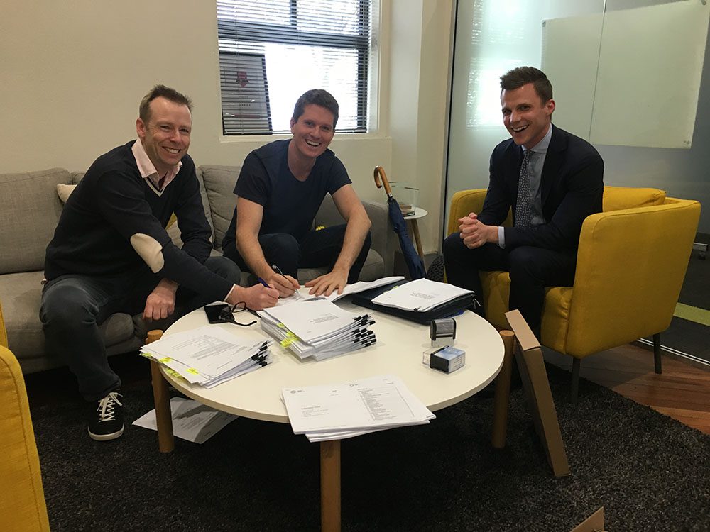(Left to Right) Rick Baker from Blackbird, yours truly and Tom Hoare from Herbert Smith Freehills as we sign the mountain of investor documents.