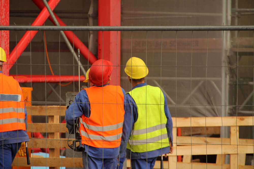 construction-workers-on-site-auditing-safety-hard-hats